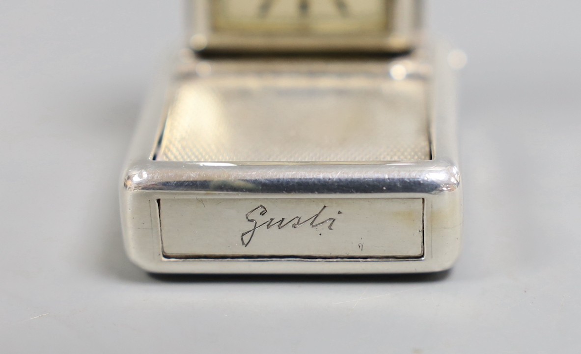 A 1930's engine turned silver traveling watch, retailed by Dunhill, with engraved name, import marks for Hernu, Peron & Stockwell Ltd? London, 1937, 35mm.